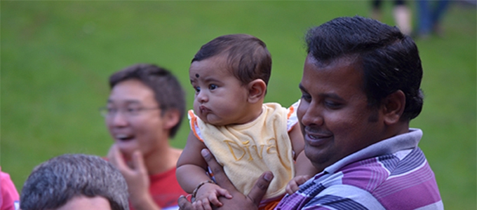 Man with child at outdoor event